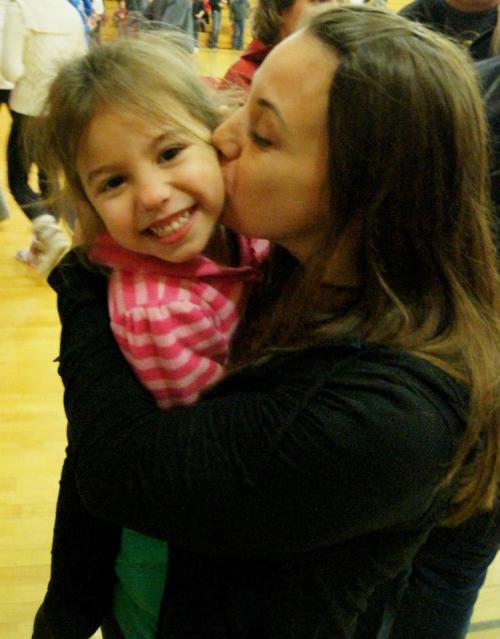 Joline LeVine and daughter Izzy celebrate the Wolf girls' win over South Whidbey last Friday.