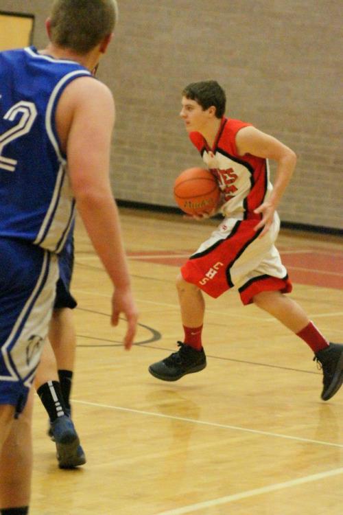 Either Wiley Hesselgrave has just been caught in mid-dribble, or he's picked up the ball and decided to run with it football-style. (Shelli Trumbull photos)
