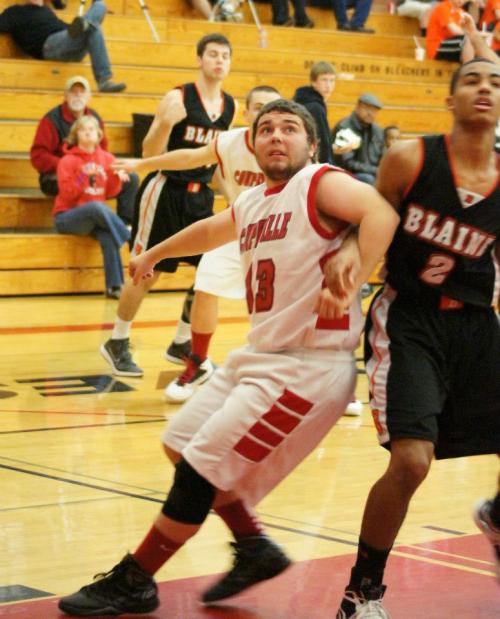 Drew Chan fights for rebounding position.