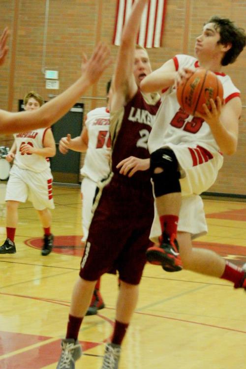 Aaron Trumbull catches some air as he slices to the hoop Tuesday.