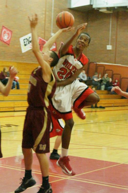 Anthony Bergeron fights for the ball during a standout performance in the night's JV game.