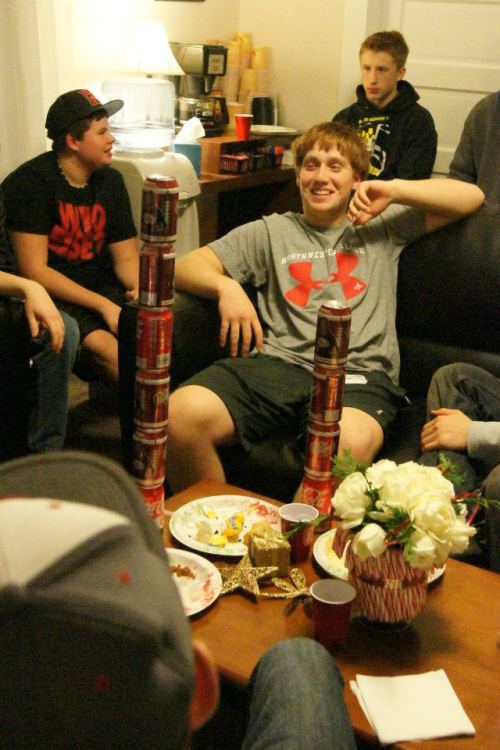 Caleb Valko basks in the glow of cans well stacked.