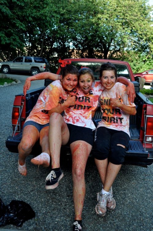 Hurlburt (right) and fellow cheerleaders Jovanah Foote (left) and Nicole Becker celebrate the end of a summer cheer camp.