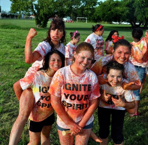 Painter (center) and fellow freshman cheerleaders celebrate at the end of a cheer camp. (Pam Headridge photo)