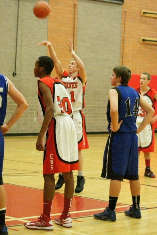 All three Wolves in this photo, Anthony Bergeron (?), Josiah Campbell (shooting free-throw) and Joel Walstad, had big plays in their team's win Thursday.