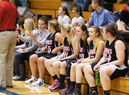 Wolf assistant coach Brittany Black imparts some wisdom to Haley Marx during a loss at La Conner Thursday.