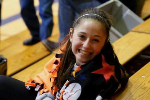 Ever the optimist, McKayla Bailey was back to all smiles by the time she was in the stands, doing homework during the boys' varsity game.