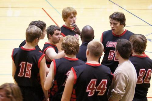 The Wolves listen as coach Anthony Smith imparts some wisdom.