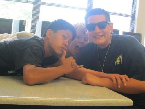 Oscar Liquidano (right), younger brother Woody (left) and one of their fans.