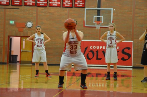 Emily Coulter prepares to let fly with the free-throw that would result in her first point as a Wolf basketball player. (Robert Bishop photos)