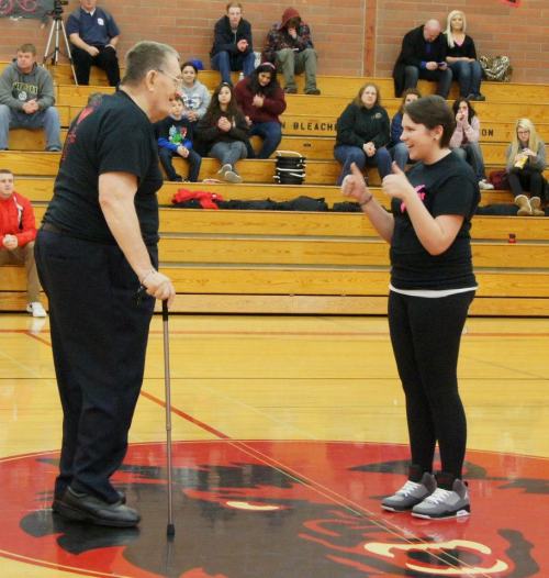 Honorary coaches for the night, cancer survivors Jim Kessler of Coupeville and Karissa Bragg of ATM.