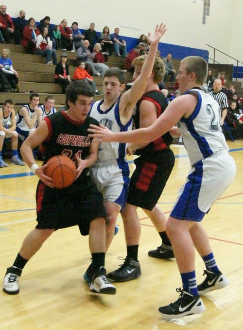 Ben Etzell looks for some room to operate as he comes off a screen set by Caleb Valko. (Shelli Trumbull photos)