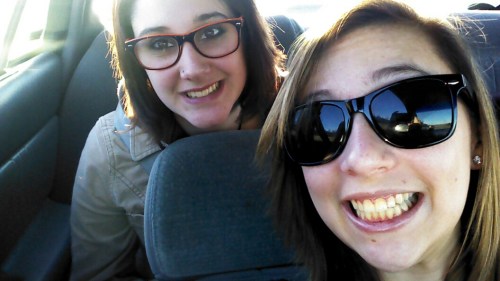 Wolf senior cheerleaders Darian Emerick (back seat) and Nicole Becker.