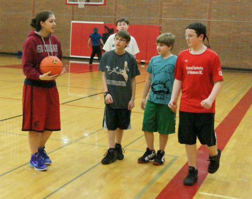 Lauren Escalle mesmerizes her young charges with her amazing shoes.