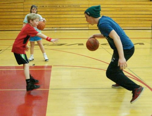 Aaron Trumbull drives hard to the hoop, mere moments before my former video store "assistant" shows him who's really in charge.