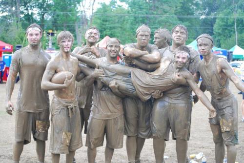 Coach V (fourth from left) and Wolf football players relax after a football camp.