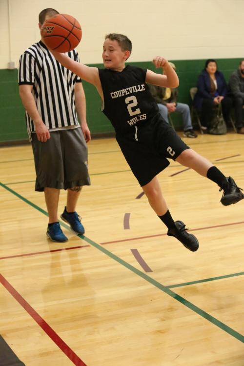 Ethan Spark does his best Superman impression, as he goes airborne to save a ball.