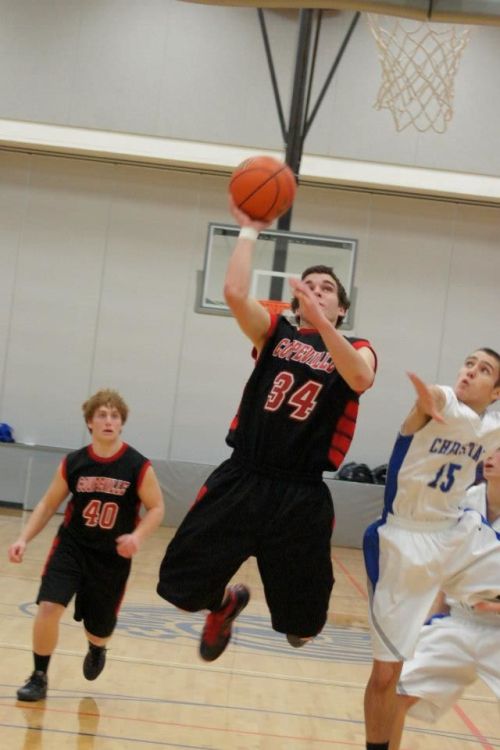Ben Etzell hangs in the air as he goes in for two against ?. (Shelli Trumbull photo)