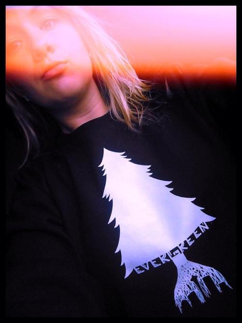 Former Wolf softball star Emma Puharic models her sweatshirt.