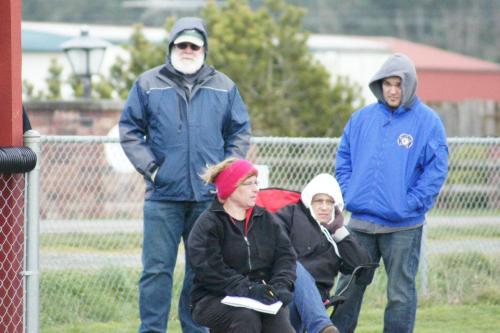 Amy King (in headgear) tries to stay warm enough to keep stats.