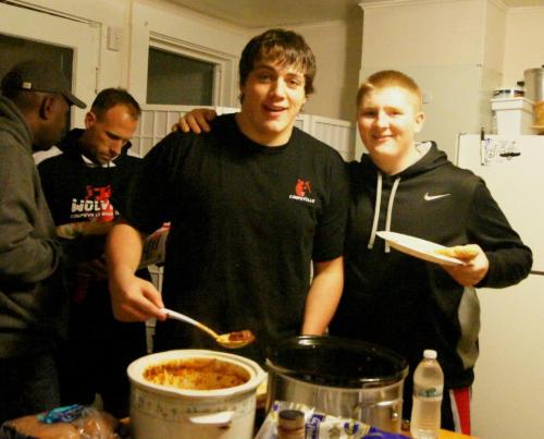 Nick Streubel (center) takes a break from being awesome to have a bite with fellow lineman Carson Risner (right). (Shelli Trumbull photo)