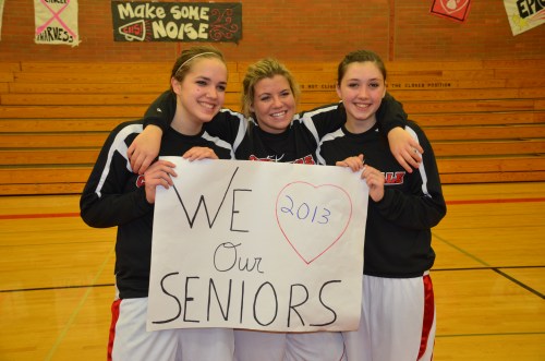 Bessie Walstad (left), Haley Marx (center) and Lauren Escalle, seen here on Senior Night, went out with class and spirit Wednesday. (Robert Bishop photo)