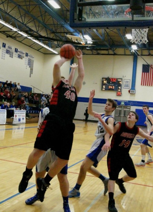 Playoff intensity, with Caleb Valko taking it hard to the hoop... (Shelli Trumbull photos)