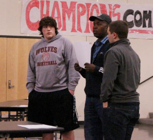 Nick Streubel (left) and Drew Chan receive the Coaches Award from Wolf head man Anthony Smith.