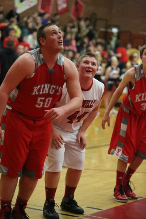 Swept away by the tunes, Carson Risner (center) finds his happy place and ignores the fact 6-foot-5 All-State lineman Mason Friedline is about to squish him.