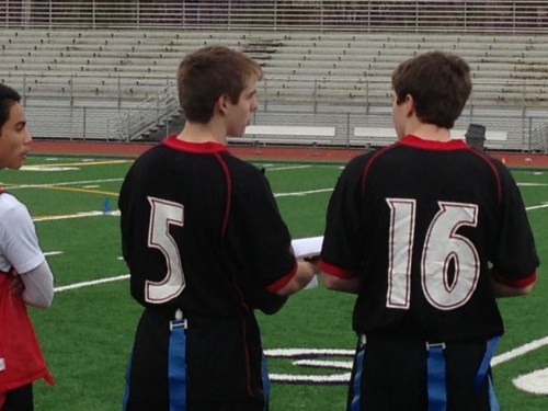 Gunnar Langvold (5) and Wiley Hesselgrave talk strategy during a recent 7-on-7 passing camp.