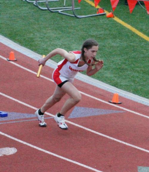 Marisa Etzell explodes out of the blocks in a meet last season. (Shelli Trumbull photo)