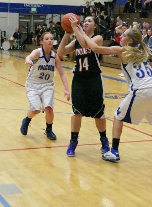 Newman (35) applies defensive pressure on Wolf Lauren Escalle earlier this season. (Shelli Trumbull photo)