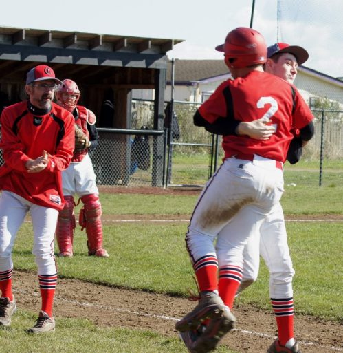 Aaron Curtin grabs a souvenir -- crunch-time hero Drew Chan (2) -- and heads off to the celebration. (Shelli Trumbull photos) 