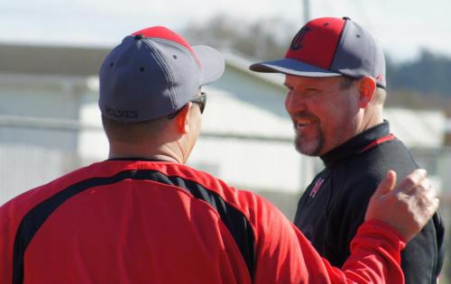 Wolf coaches Chris Tumblin (left) and Willie Smith bask in the glow.
