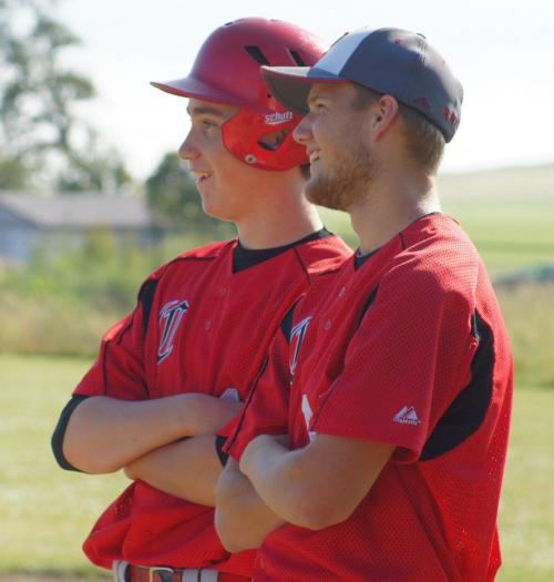 This is what baseball players look like in the sun, as Aaron Trumbull (left) talks to assistant coach Ian Smith last season. (Shelli Trumbull photos)
