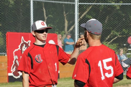 See? There's also sun during this discussion between Wade Schaef (left) and assistant coach Casey Larson.