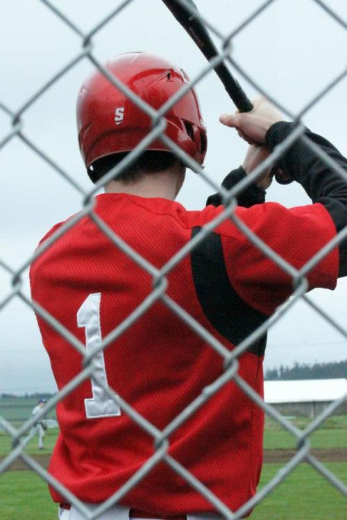 Wade Schaef faces down the storm, armed only with his trusty bat. (Justine McGranahan photo)