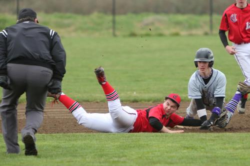 Drew Chan gets his uniform mussed up a bit. (John Fisken photos)