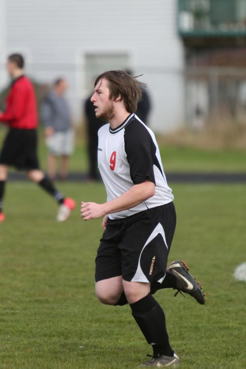 Co-captain Jason Knoll heads up-field.