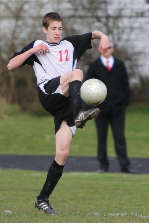 Josh Datin goe shigh for a ball.