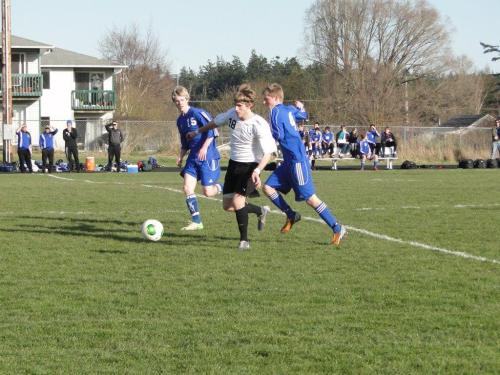 Josh Wilsey splits the Falcon defense as he charges up-field Saturday. (Janine Bundy photos)
