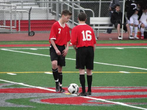 Zane Bundy (left) and Donley confer on strategy.