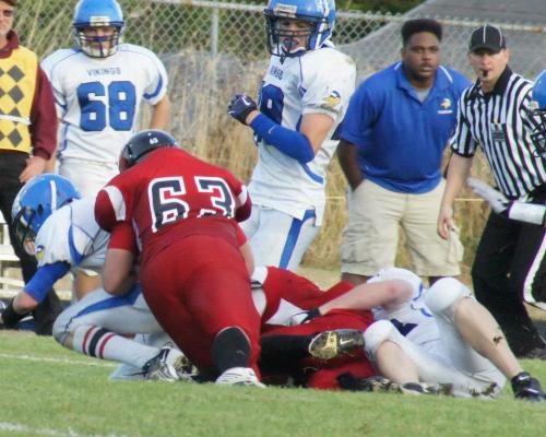 Pop quiz, hotshot. Was it legal for a football coach to be rockin' a haircut like that in 2012? (Shelli Trumbull photos)