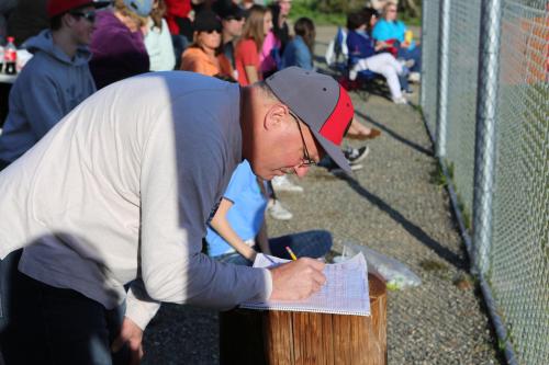 Chris Chan works his score book magic. (John Fisken photo)