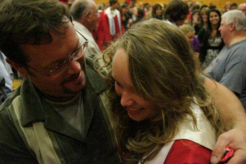 Husband Brad and daughter Alexis during the latter's high school graduation.