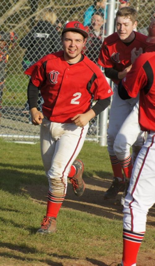 Drew Chan celebrates Wade Schaef's epic two-run blast over the fence.