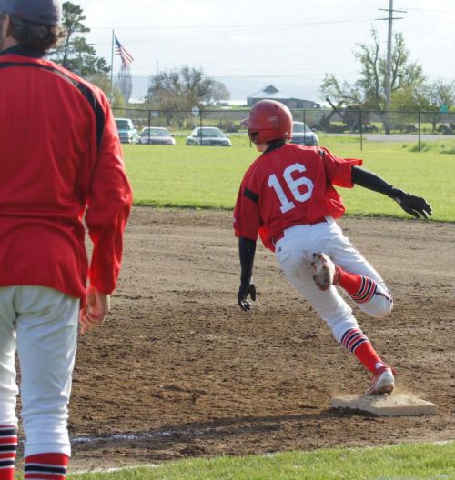 Cole Payne catches an updraft as he rounds first ...