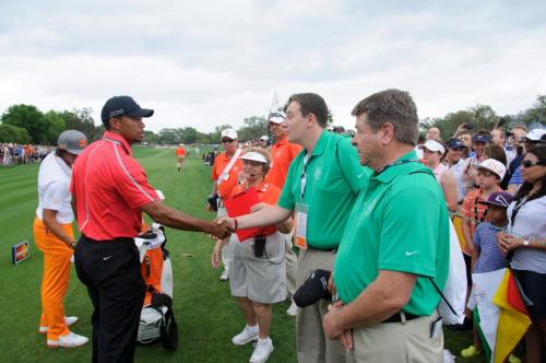 Austin Fields, 3-0 in his senior campaign, takes a moment to talk to Tiger Woods about how to fix his game.