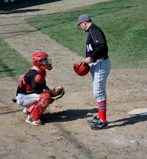 Wolf coach Willie Smith talks strategy with Jake Tumblin.