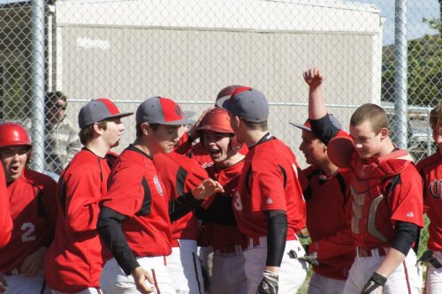 Josh Bayne gets mobbed after his two-run moon shot. (Shelli Trumbull photos)